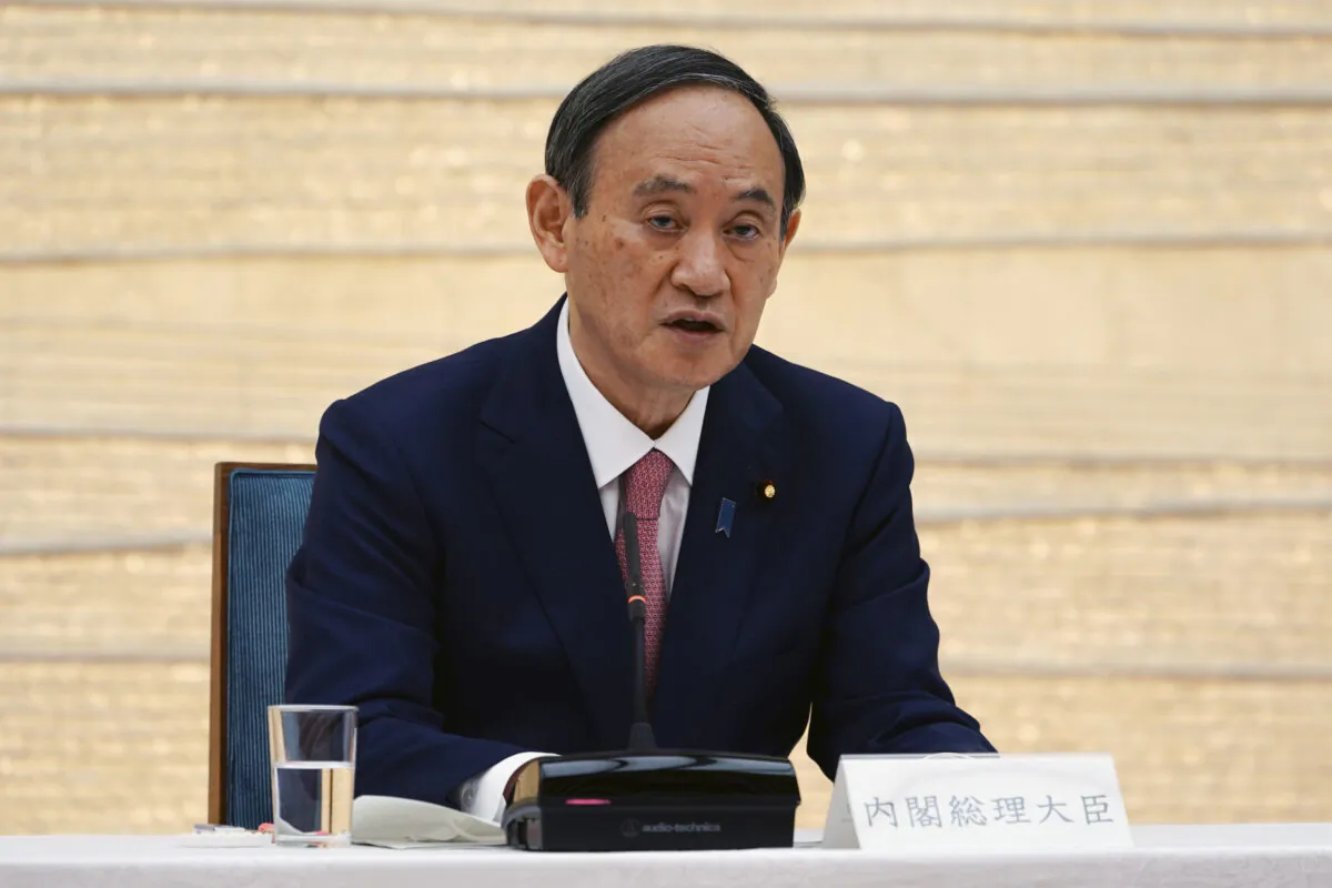 Japanese Prime Minister Yoshihide Suga announces that Tokyo, Kyoto and Okinawa will be applied for pre-emergency status under a new prevention law during a government task force meeting at the prime minister's office in Tokyo on April 9, 2021. (Eugene Hoshiko/AP Photo)