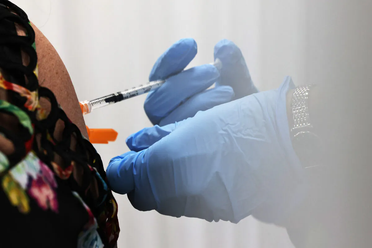 A COVID-19 vaccine is administered in in New York City on April 8, 2021. (Michael M. Santiago/Getty Images)