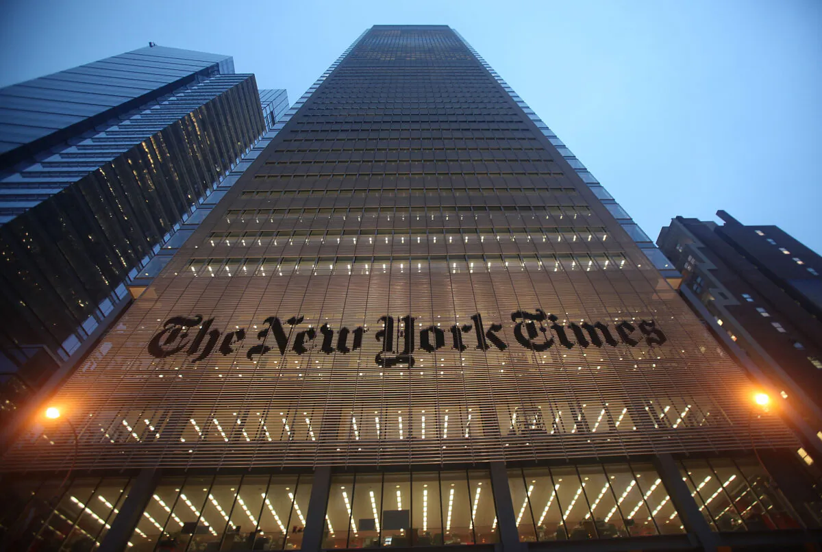 The New York Times' masthead is displayed in front of the midtown headquarters in New York City on Dec. 7, 2009. (Mario Tama/Getty Images)