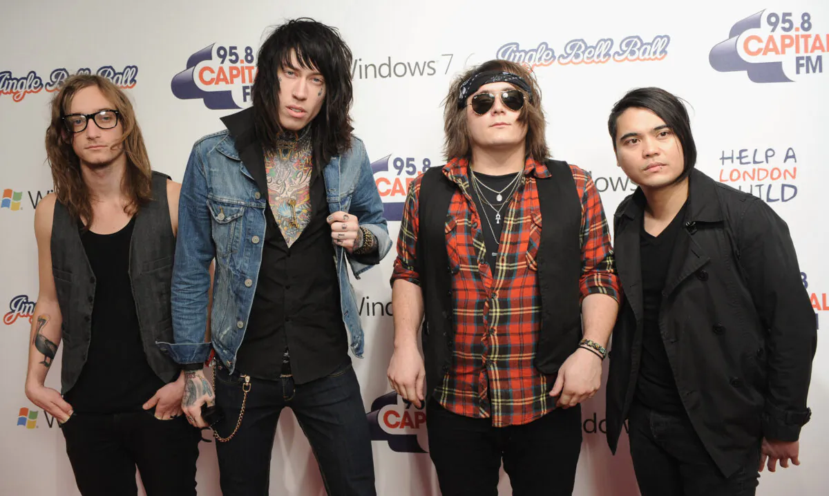 (L-R) Blake Healy, Trace Cyrus, Mason Musso and Anthony Improgo of 'Metro Station' attend the Capital FM Jingle Bell Ball - Day 2 at 02 Arena in London, England on Dec. 6, 2009. (Ian Gavan/Getty Images)