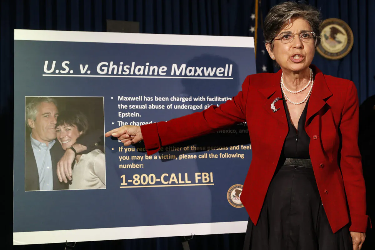 Audrey Strauss, Acting United States Attorney for the Southern District of New York, points to a photograph of Jeffrey Epstein and his ex-girlfriend Ghislaine Maxwell, on July 2, 2020. (John Minchillo/AP Photo)