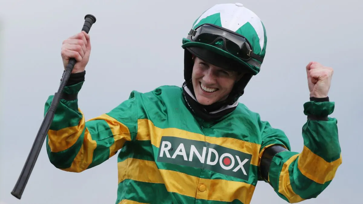 Jockey Rachael Blackmore celebrates winning the Grand National riding Minella Times at Aintree Racecourse in Liverpool, UK, on April 10, 2021. (Scott Heppell/Pool via Reuters)
