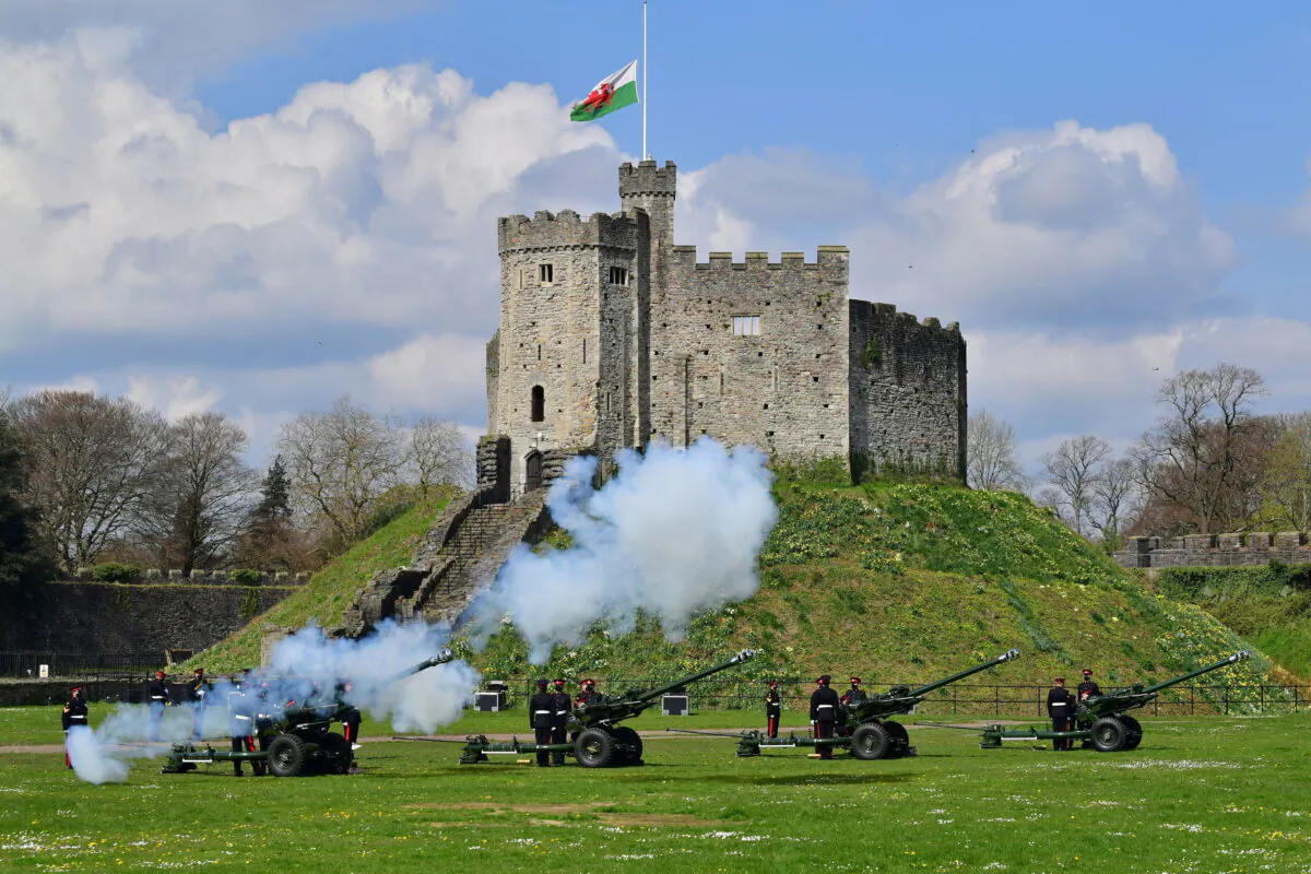 Members of the 104th Regiment Royal Artillery fire a 41-round gun salute in the grounds of Cardiff Castle, to mark the death of Prince Philip, in Cardiff, on Apr. 10, 2021. (Ben Birchall/PA via AP)