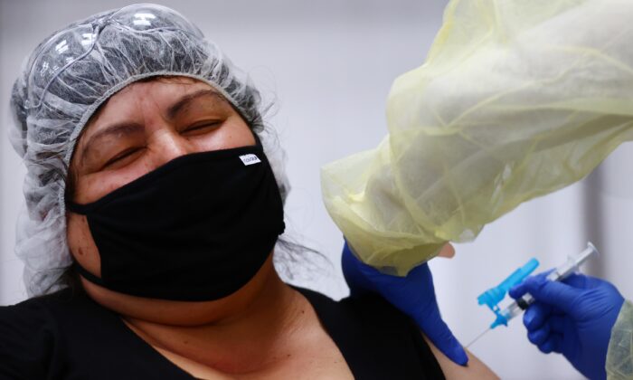 Eloina Galvez receives a one shot dose of the Johnson & Johnson COVID-19 vaccine at a clinic geared toward agriculture workers in Riverside, Calif., on April 5, 2021. (Mario Tama/Getty Images)