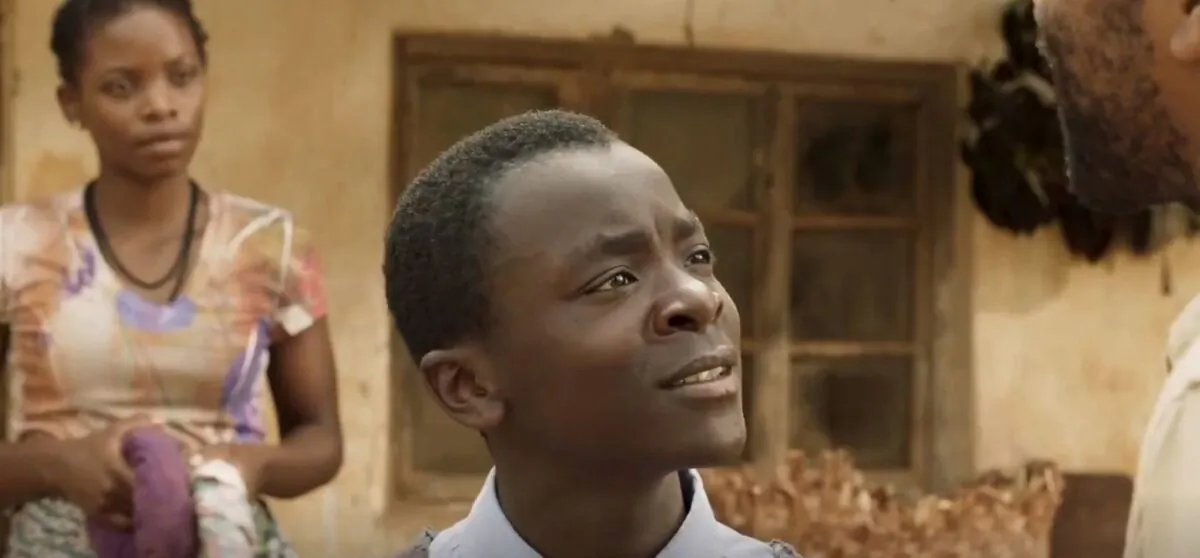 William Kamkwamba (Maxwell Simba, C) earnestly wants to save his village from starvation, and he has an idea about how to do that. (Netflix)