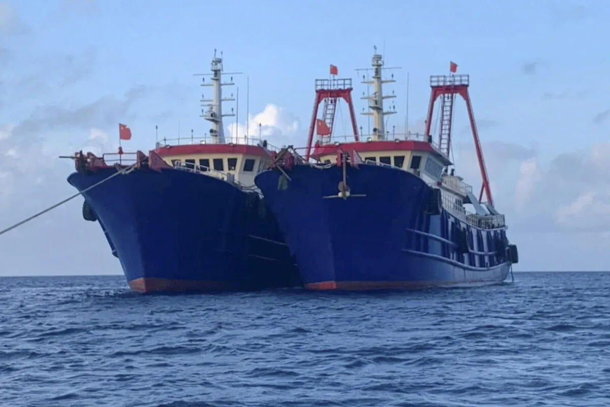 Chinese vessels are moored at Whitsun Reef, South China Sea on March 27, 2021. (National Task Force-West Philippine Sea via AP)