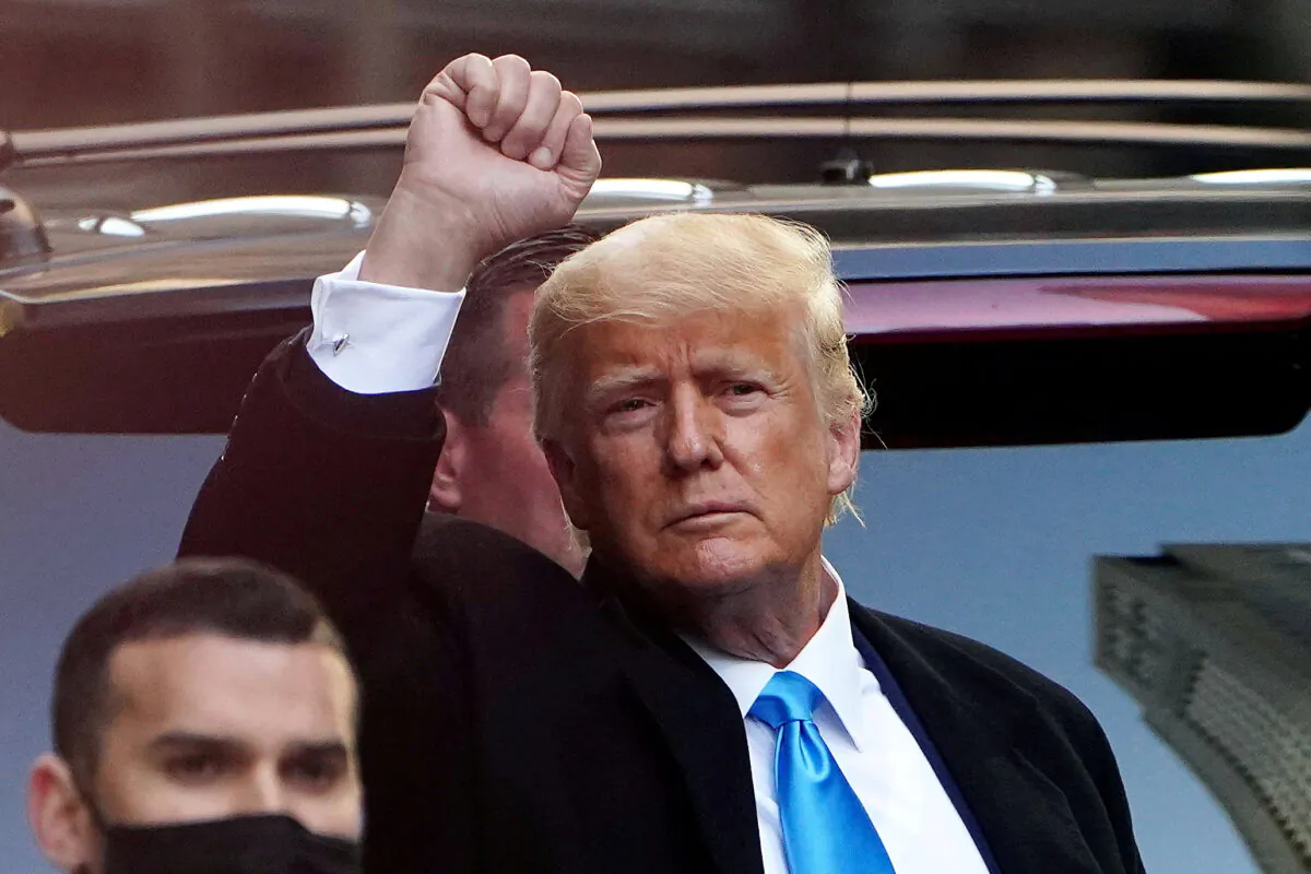 Former President Donald Trump acknowledges people as he gets in his SUV outside Trump Tower in the Manhattan borough of New York City on March 9, 2021. (Carlo Allegri/Reuters)