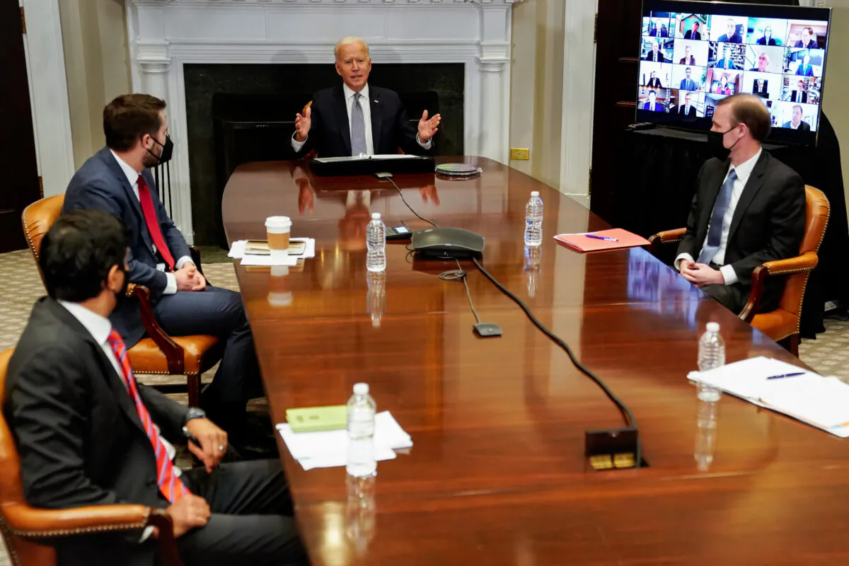 President Joe Biden (C) speaks during a CEO Summit on Semiconductor and Supply Chain Resilience via video conference with National Economic Council Director Brian Deese (2nd L), National Security Advisor Jake Sullivan (R) and others from the Roosevelt Room at the White House on April 12, 2021 in Washington. (Amr Alfiky-Pool/Getty Images)