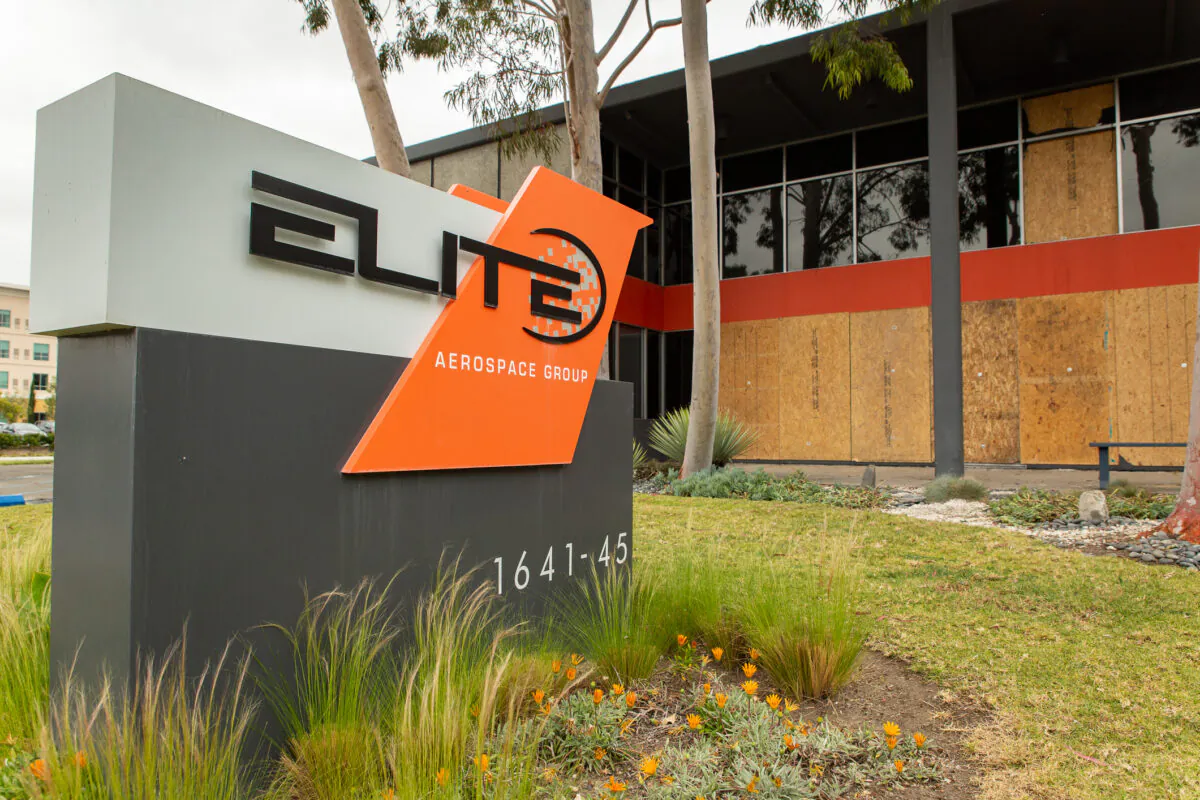 Boards cover the Elite Aerospace Group building two days after a fire in Irvine, Calif., on April 12, 2021. (John Fredricks/The Epoch Times)