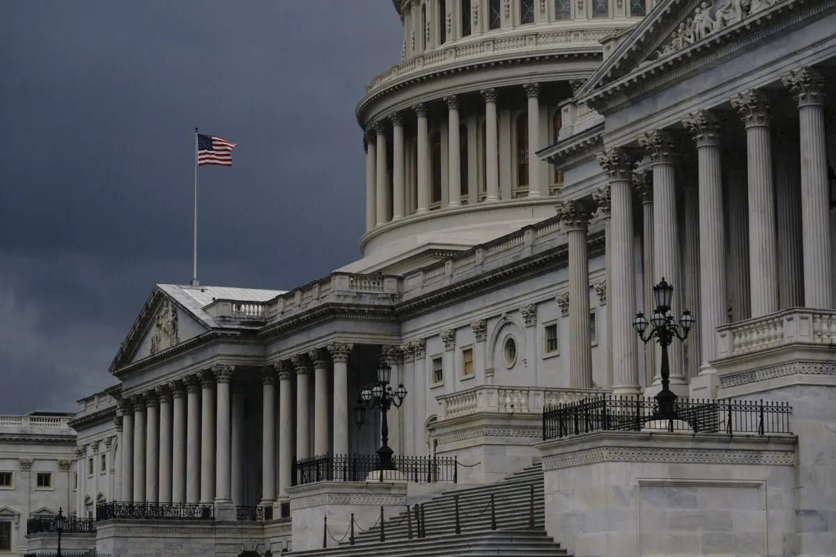 Dark clouds and heavy rain sweep over the U.S. Capitol in Washington on Aug. 3, 2020. (J. Scott Applewhite/AP Photo)