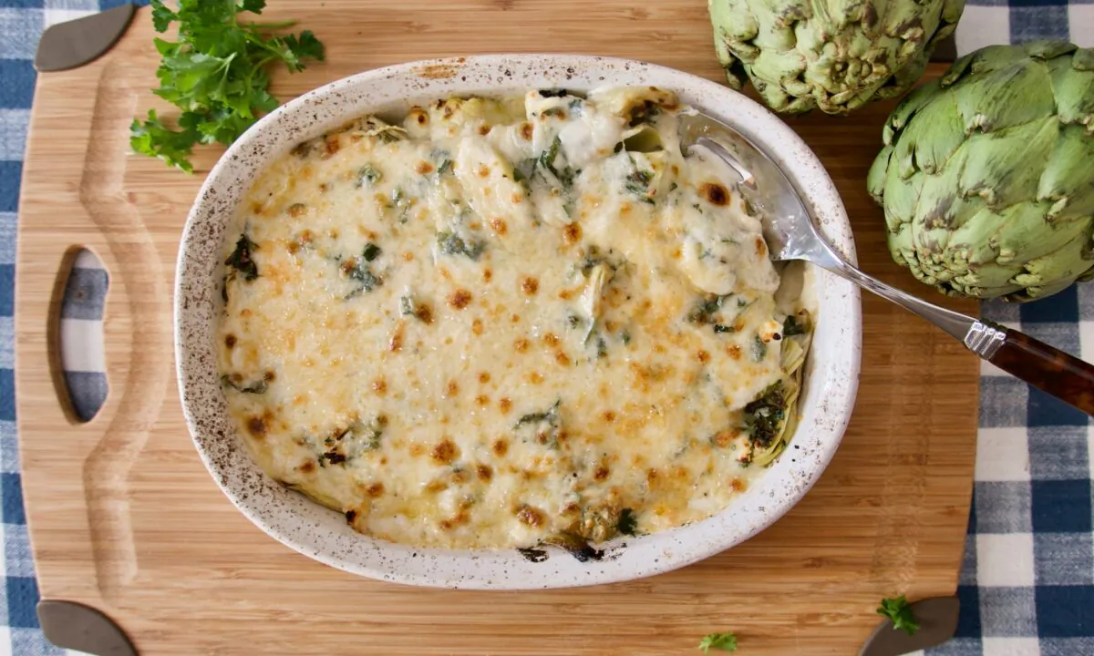 This gratin starts with frozen or canned artichoke hearts, and ends with a golden layer of melted cheese. (Victoria de la Maza)