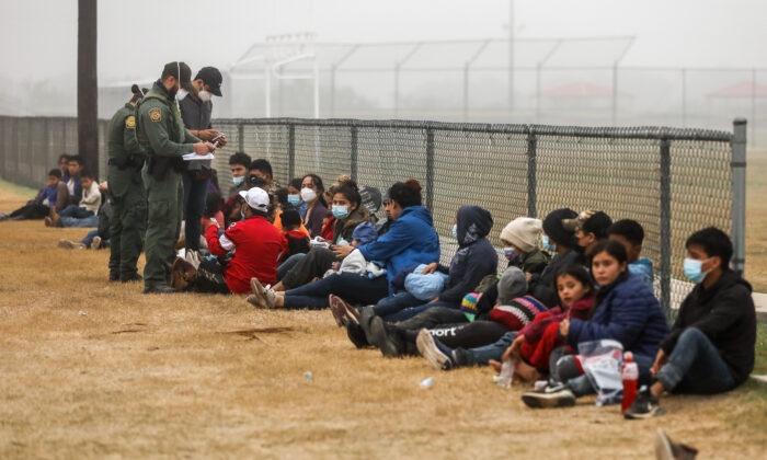 A group of illegal immigrants is processed by Border Patrol after crossing the U.S.-Mexico border in La Joya, Texas, on April 10, 2021. (Charlotte Cuthbertson/The Epoch Times)