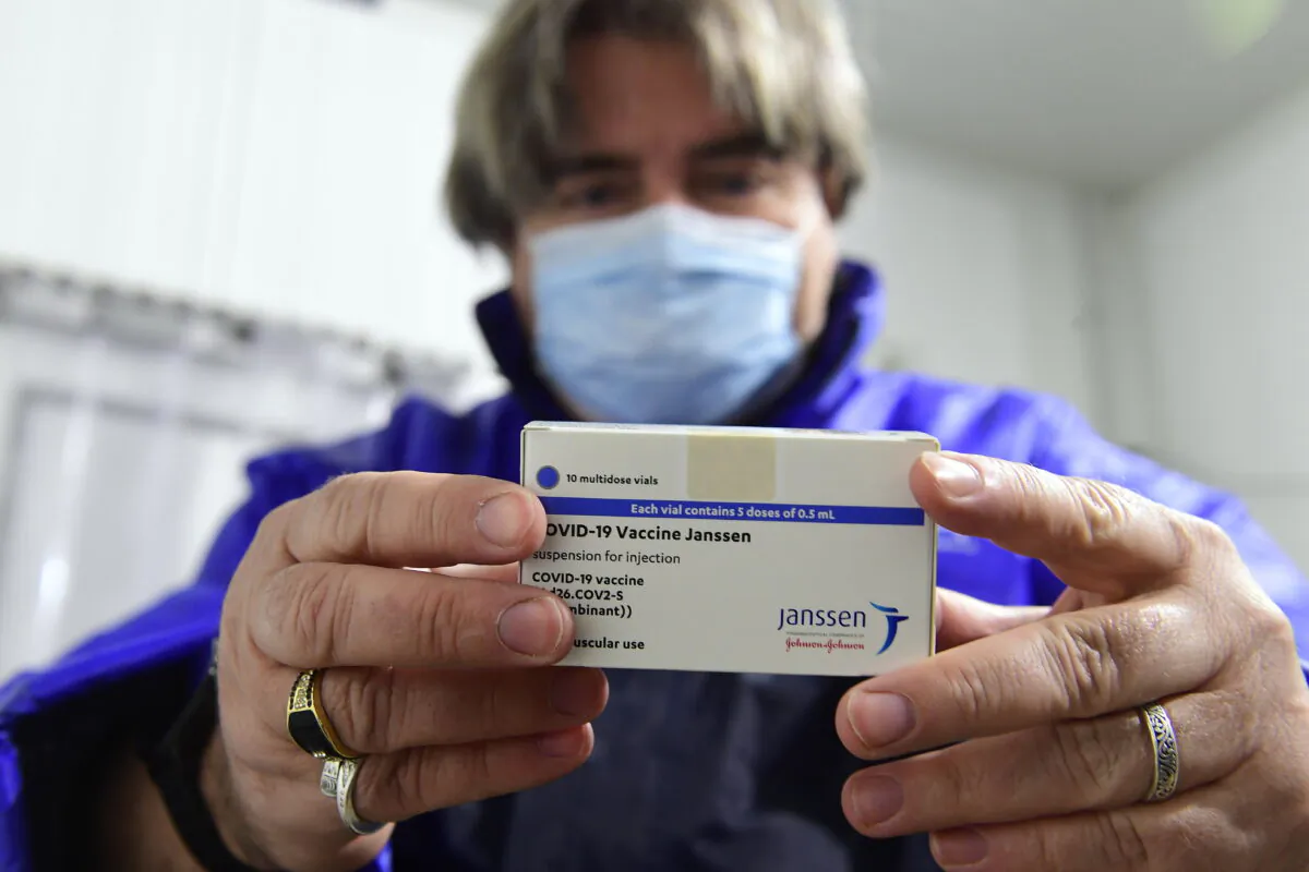 A box of Janssen vaccines is shown by pharmacist Zsolt Szenasi at a warehouse of Hungaropharma, a Hungarian pharmaceutical wholesale company, in Budapest, Hungary, after the arrival of the first batch of the Johnson & Johnson, made one-dose vaccine against the new coronavirus in the country, on April 13, 2021. (Szilard Koszticsak/MTI via AP)