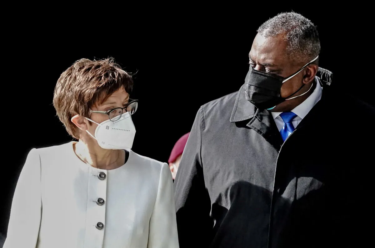 U.S. Secretary of Defense Lloyd Austin (R) and his German counterpart Annegret Kramp-Karrenbauer talk to each other at the Bendlerblock German Ministry of Defense in Berlin, Germany, on April 13, 2021. (Kay Nietfeld/Pool via Reuters)