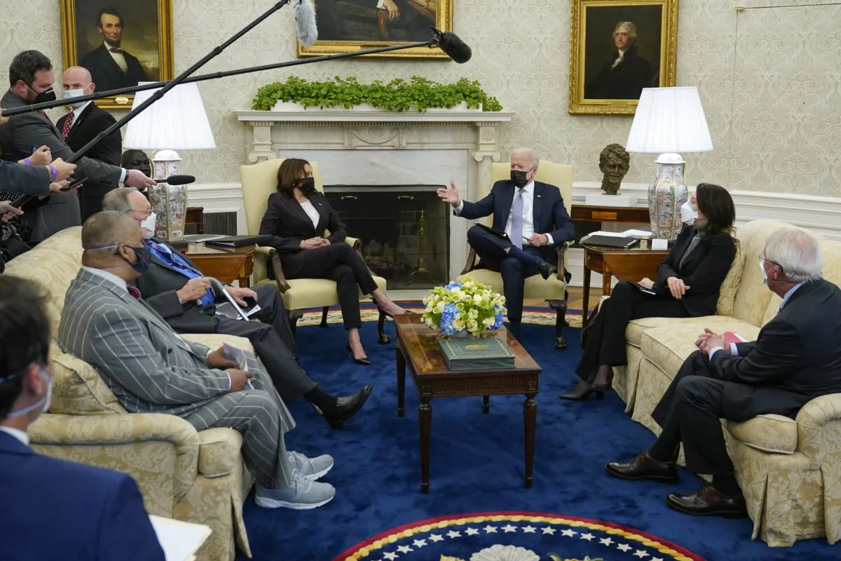 President Joe Biden and Vice President Kamala Harris meet with lawmakers to discuss his infrastructure plan, in the Oval Office of the White House in Washington on April 12, 2021. (Patrick Semansky/AP Photo)