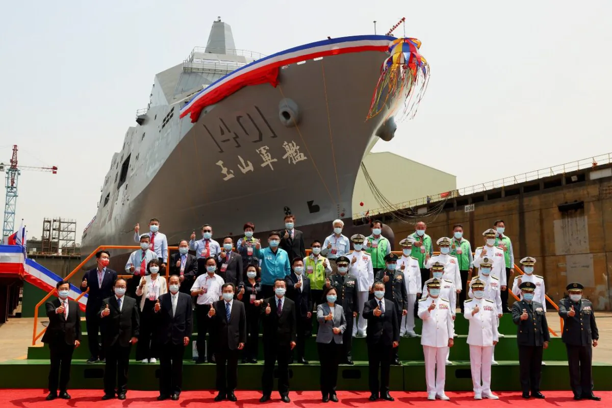 Taiwan's President Tsai Ing-wen poses for a group photo in front of Taiwan Navy's domestically built amphibious transport dock "Yushan" during its launching ceremony in Kaohsiung, Taiwan, on April 13, 2021. (Ann Wang/Reuters)