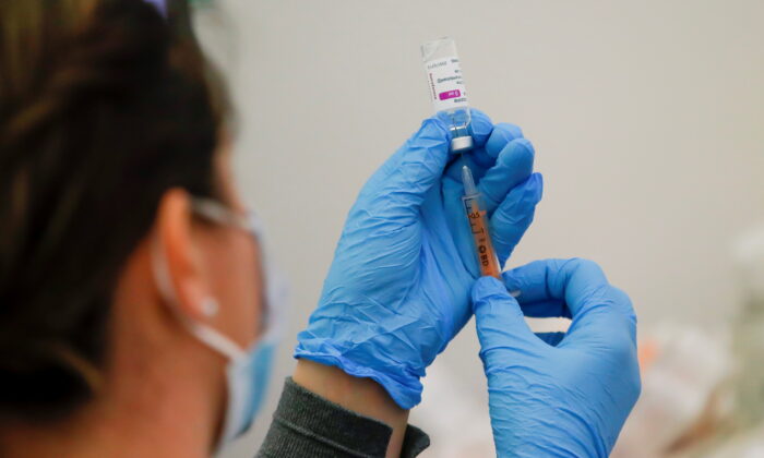 A dose of the AstraZeneca COVID-19 vaccine is prepared in a vaccination center at Newmarket Racecourse, amid the coronavirus disease outbreak in Newmarket, England, on March 26, 2021. (Andrew Couldridge/Reuters)