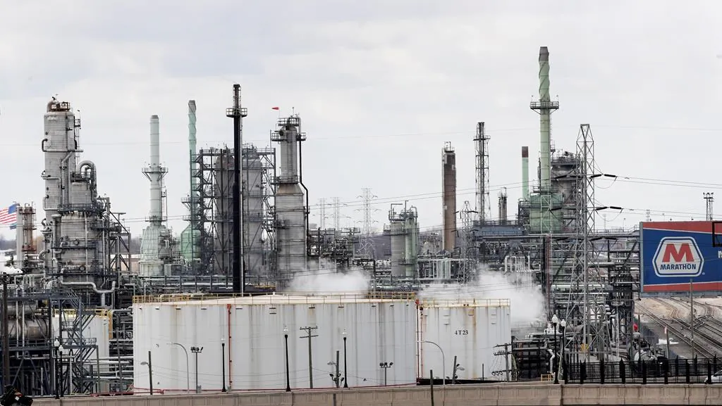 Storage tanks are shown at the Marathon Petroleum Corp. refinery in Detroit, on April 21, 2020. (AP Photo/Paul Sancya)