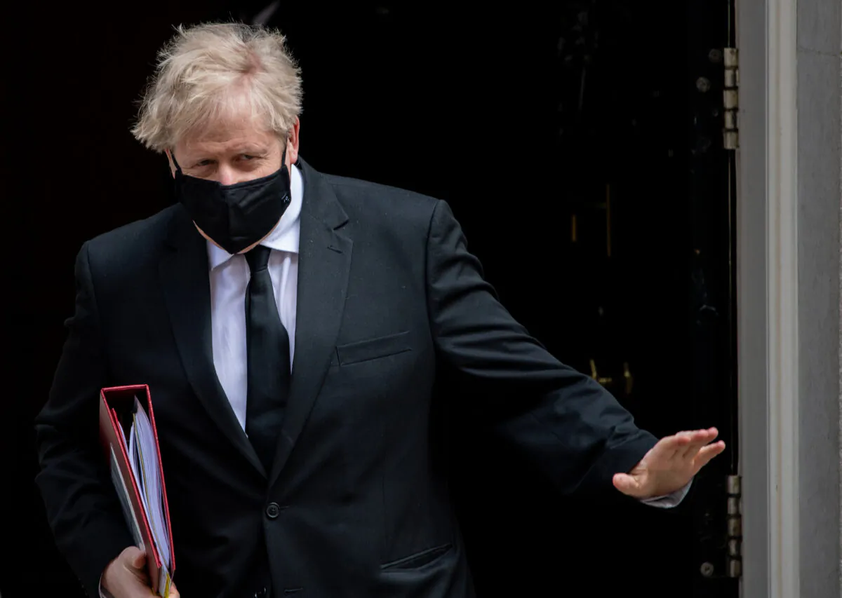 British Prime Minister Boris Johnson leaves for the first Prime Ministers Questions after the Easter Recess at Downing Street in London, on Apr. 14, 2021. (Chris J Ratcliffe/Getty Images)
