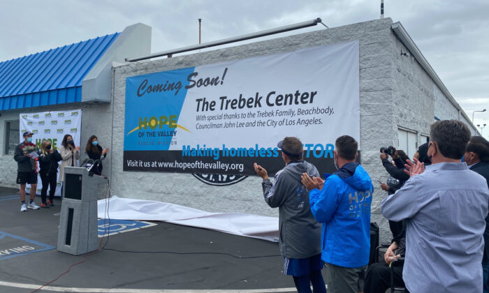 Officials celebrate the conversion of a closed roller skating rink into a bridge housing facility for the homeless in Northridge, north Los Angeles, on March 25, 2021. (Jamie Joseph/The Epoch Times)