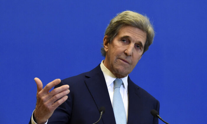 U.S. Special Presidential Envoy for Climate John Kerry gestures as he addresses a press conference after a meeting with France's Economy and Finance Minister at The Ministry of Economy in Paris, France, on March 10, 2021. (Eric Piermont/AFP via Getty Images)