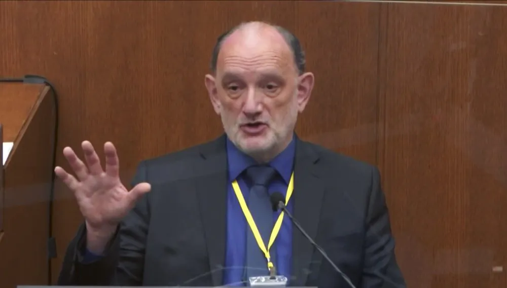 In this image from video, Dr. David Fowler, a retired forensic pathologist and former chief medical examiner for the state of Maryland testifies as Hennepin County Judge Peter Cahill presides in the trial of former Minneapolis police Officer Derek Chauvin at the Hennepin County Courthouse in Minneapolis, Minn., on April 14, 2021. (Court TV via AP)