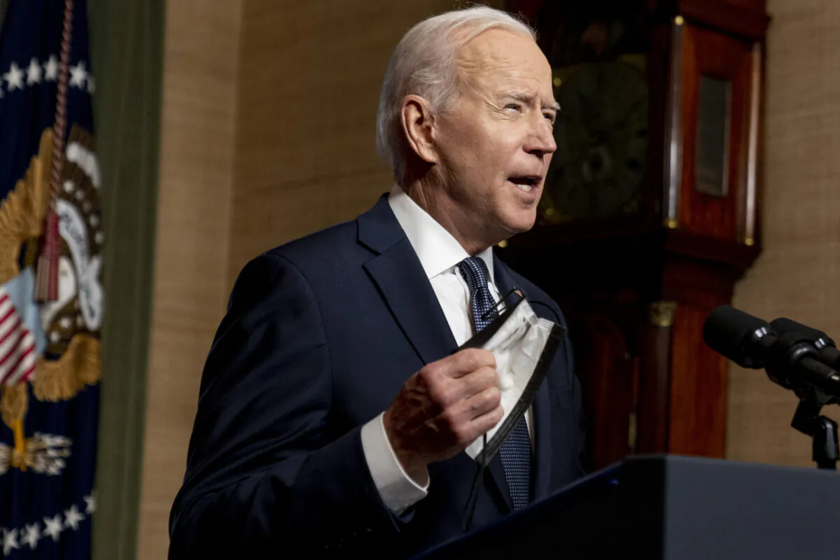 President Joe Biden removes his mask to speak from the Treaty Room in the White House about the withdrawal of the remainder of U.S. troops from Afghanistan in Washington on April 14, 2021. (Andrew Harnik/Pool/Abacapress.com)