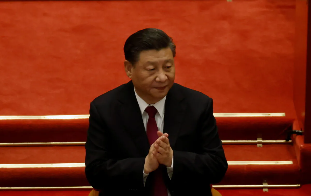 Chinese leader Xi Jinping applauds at the closing session of the Chinese People's Political Consultative Conference (CPPCC) at the Great Hall of the People in Beijing, China, on March 10, 2021. (Carlos Garcia Rawlins/Reuters)