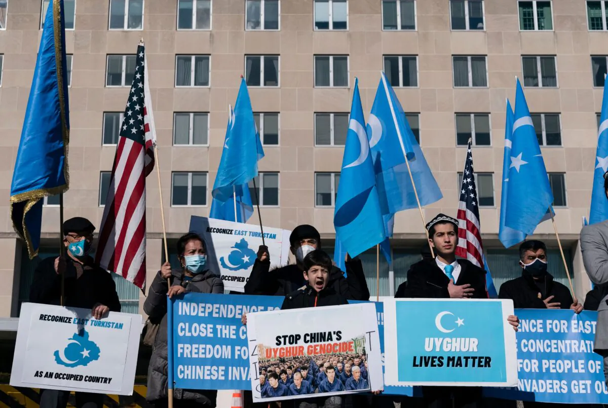 Uyghurs of the East Turkistan National Awakening Movement (ETNAM) hold a rally outside the U.S. State Department calling on President Joe Biden to increase pressure on the Chinese Communist Party, in Washington, on Feb. 5, 2021 (Alex Edelman/AFP via Getty Images)
