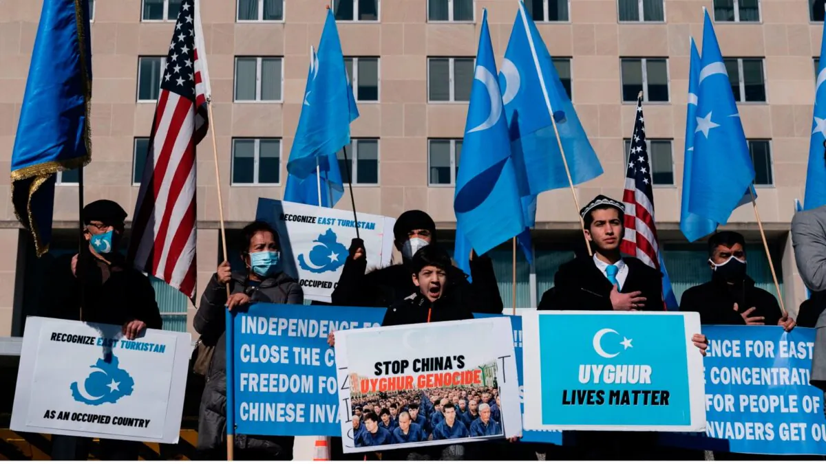 Uyghurs of the East Turkistan National Awakening Movement (ETNAM) hold a rally outside the U.S. State Department calling on U.S. President Joe Biden to increase pressure on the Chinese Communist Party, in Washington on Feb. 5, 2021. (Alex Edelman/AFP via Getty Images)