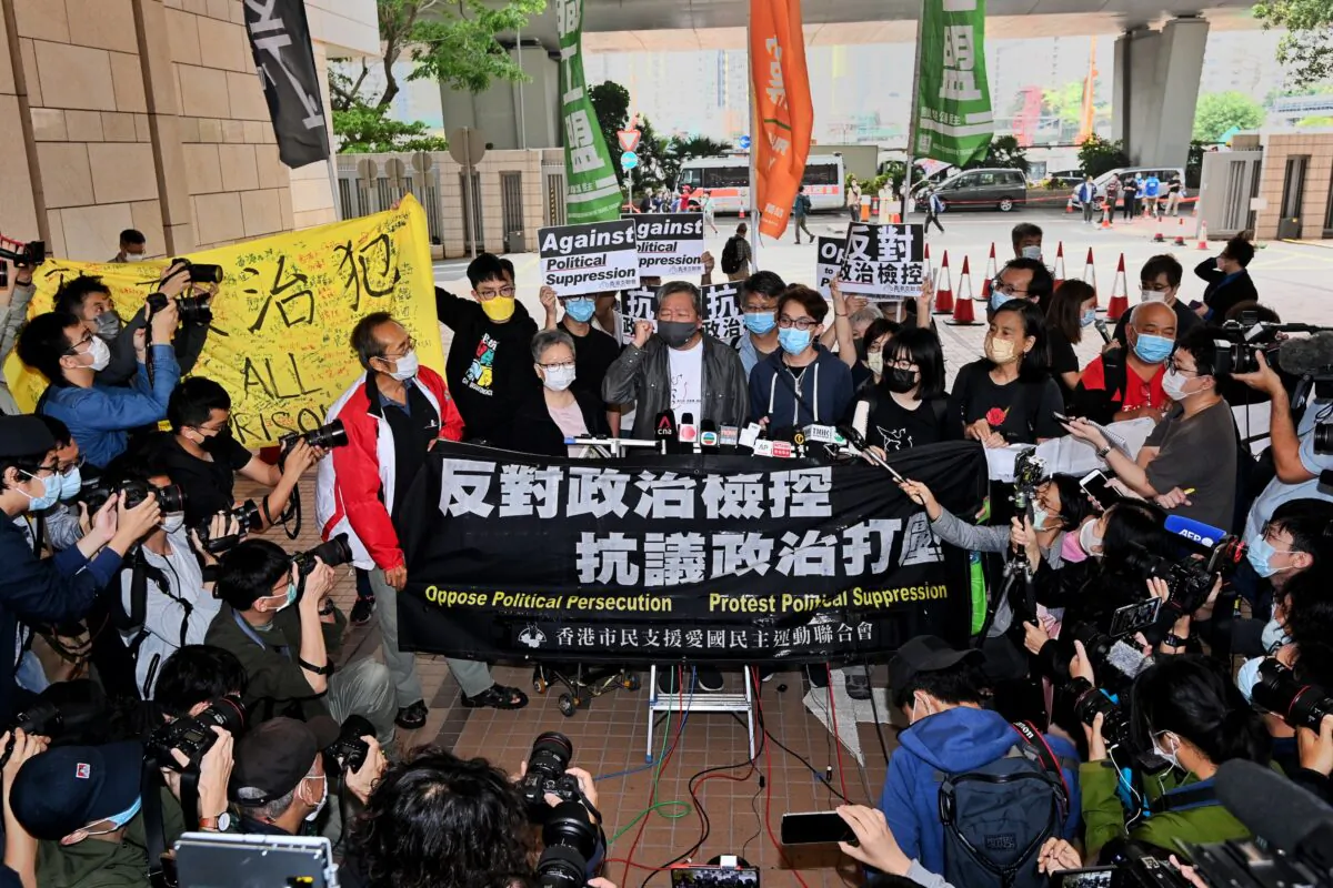 Margaret Ng (L), Lee Cheuk-yan (C), and Figo Chan (R), the convener of the local pro-democracy group Civil Human Rights Front, speak to reporters outside of the West Kowloon court building in Hong Kong, on April 16, 2021. (Sung Pi-lung/The Epoch Times)