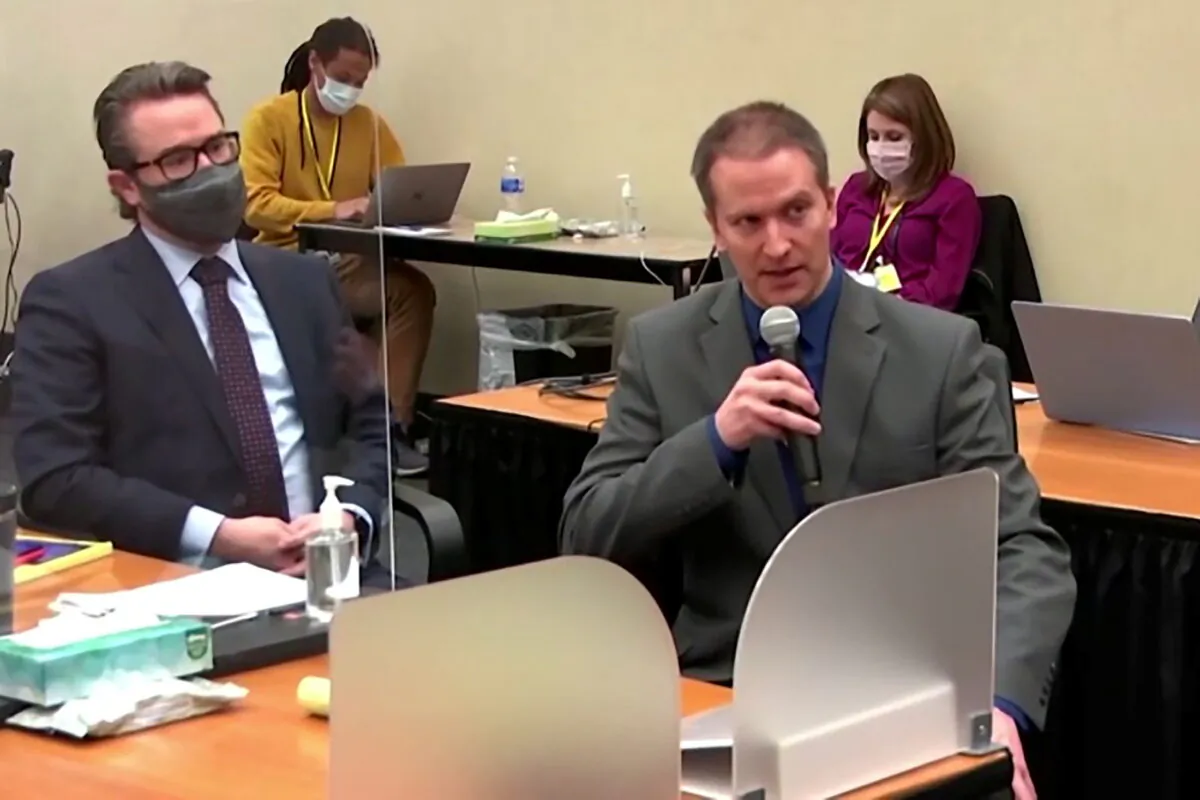 In a still image from video, former Minneapolis police officer Derek Chauvin tells the judge that he waived his right to testify to the jury, next to his defense attorney Eric Nelson, on the fourteenth day of Chauvin's trial for second-degree murder, third-degree murder and second-degree manslaughter in the death of George Floyd, in Minneapolis, Minn., on April 15, 2021. (Pool via Reuters)