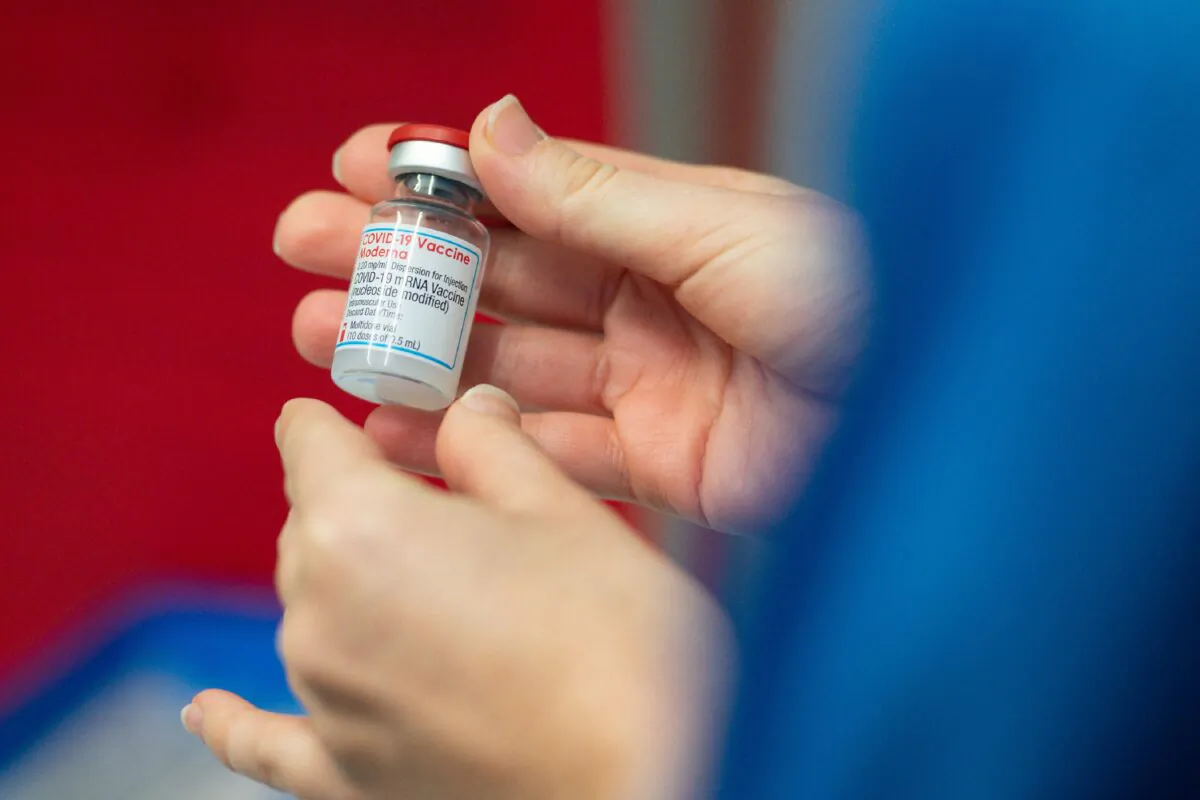 A healthcare professional holds a vial of the Moderna COVID-19 vaccine at the West Wales General Hospital in Carmarthen, Wales, on April 7, 2021. (Jacob King/AFP via Getty Images)