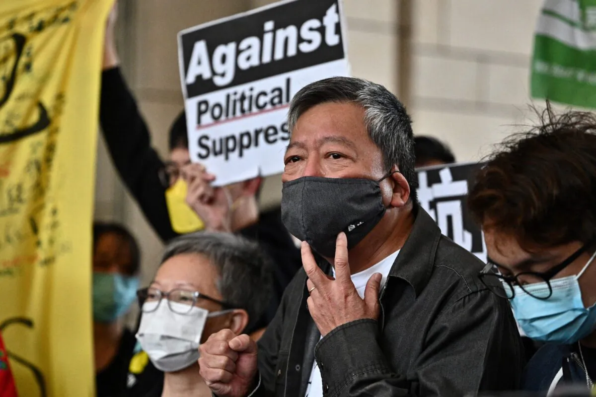 Pro-democracy activist Lee Cheuk-yan (C) arrives at West Kowloon court in Hong Kong on April 16, 2021, to receive sentencing after being found guilty of organising an unauthorised assembly on August 18, 2019.  (Anthony Wallace/AFP via Getty Images)