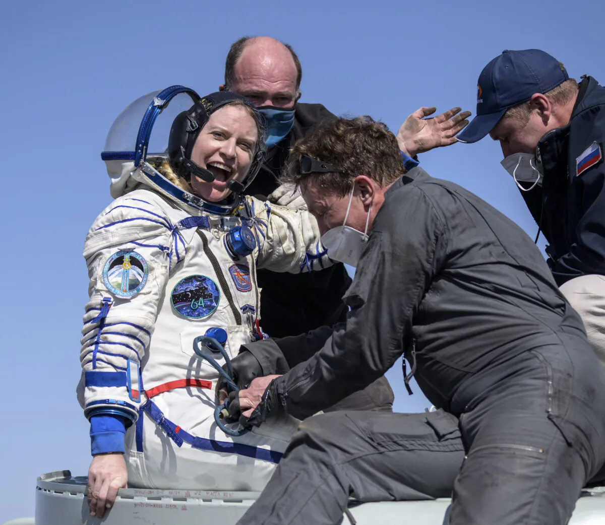 Expedition 64 NASA astronaut Kate Rubins is helped out of the Soyuz MS-17 spacecraft just minutes after she, and Roscosmos cosmonauts Sergey Kud-Sverchkov, and Sergey Ryzhikov landed in a remote area near the town of Zhezkazgan, Kazakhstan on April 17, 2021. (Bill Ingalls/NASA via AP)