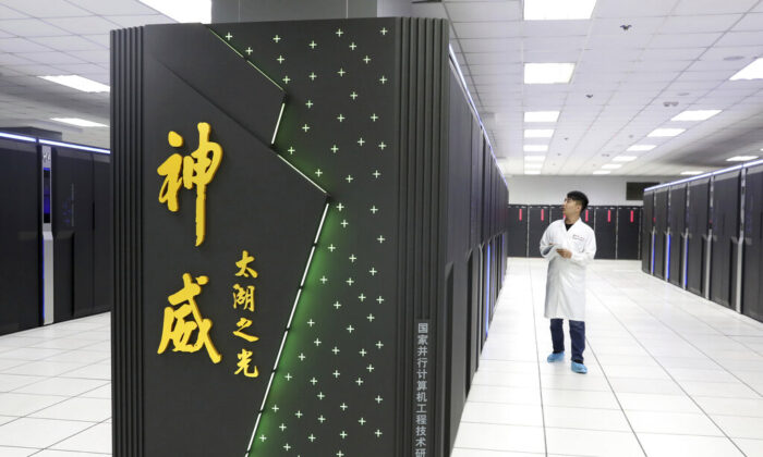 A worker monitors the Shenwei (Sunway) TaihuLight supercomputer at the National Supercomputer Center in Wuxi in eastern China's Jiangsu Province on Aug. 29, 2020. (Chinatopix via AP)