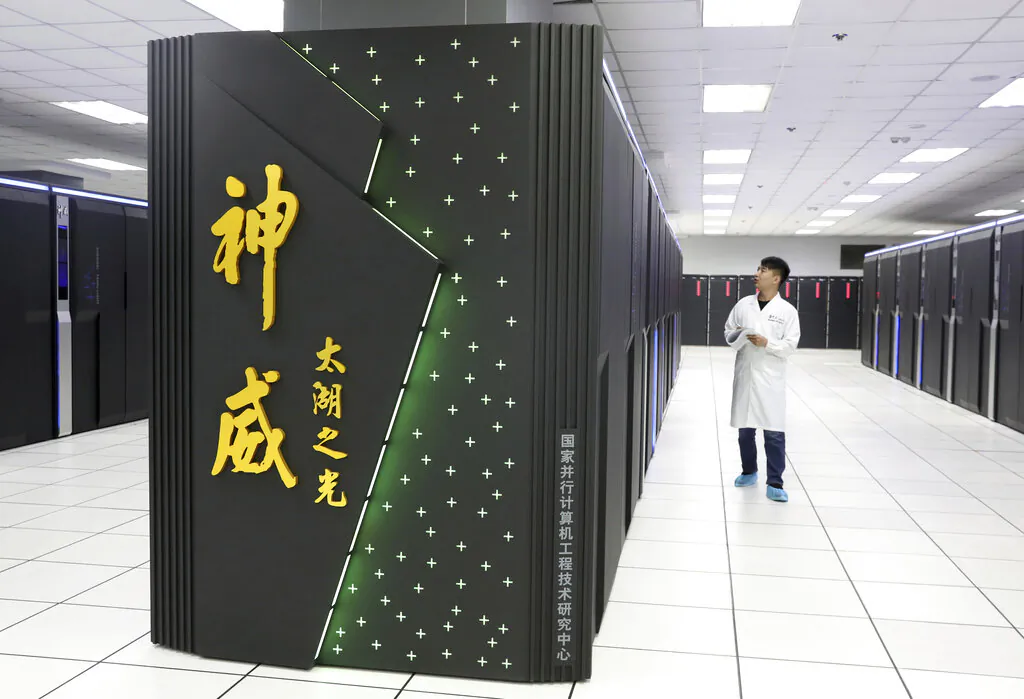 A worker monitors the Shenwei (Sunway) TaihuLight supercomputer at the National Supercomputer Center in Wuxi in eastern China's Jiangsu Province on Aug. 29, 2020. (Chinatopix via AP)