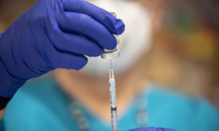 A nurse fills up a syringe with a COVID-19 vaccine at a senior center in San Antonio, Texas, on March 29, 2021. (Sergio Flores/Getty Images)