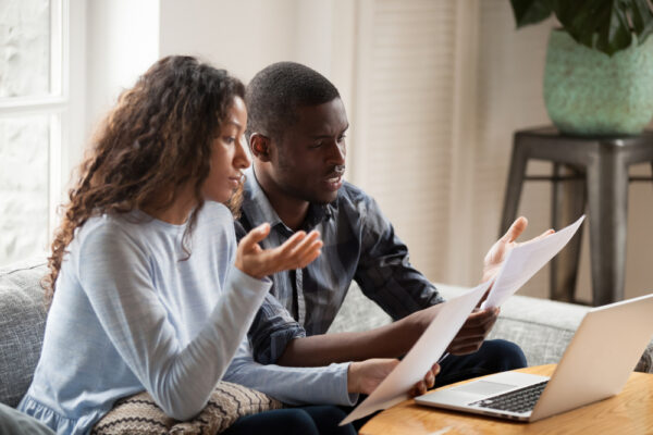 Concerned,Mixed,Race,Husband,And,Wife,Take,Care,Of,Domestic