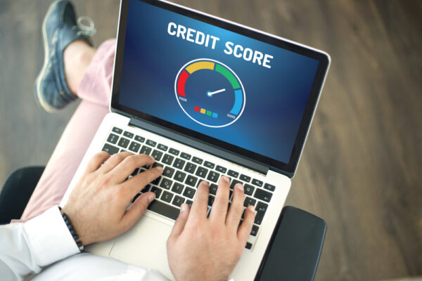 People,Using,Laptop,And,Credit,Score,Concept,On,Screen