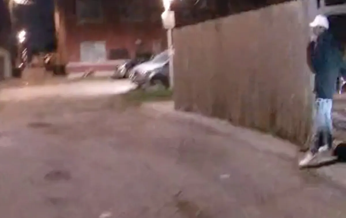 Adam Toledo holds what appears to be a pistol in his right hand moments before he was shot by a police officer in Chicago, Ill., on March 29, 2021. (Screenshot/Civilian Office of Police Accountability)