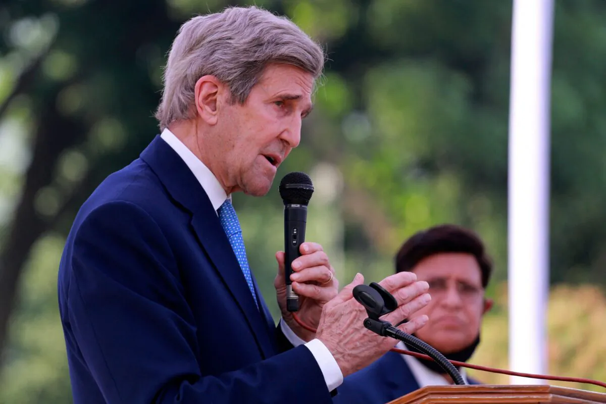 US climate envoy John Kerry (L) speaks as Bangladesh's Foreign Minister AK Abdul Momen watches during a press briefing in Dhaka on April 9, 2021. (Rehman Asad / AFP via Getty Images)