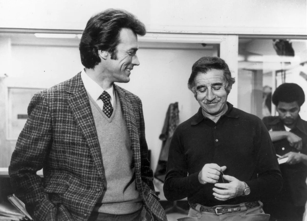 American actor-directors Clint Eastwood (L) and Don Siegel talking on the set of "Dirty Harry". The two worked together on three films, including "Coogan's Bluff," "Dirty Harry," and "Play Misty for Me." (Hulton Archive/Getty Images)
