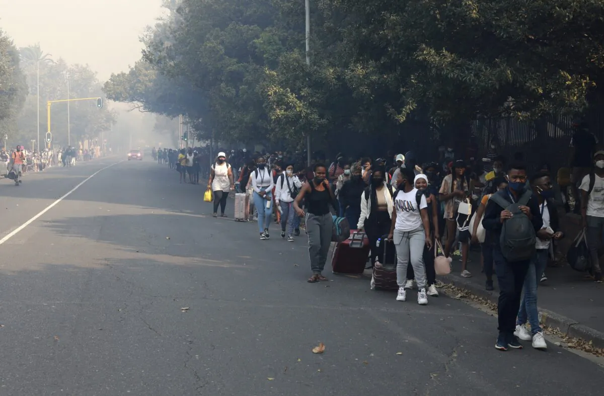 Students make their way after being evacuated from their residence at the University of Cape Town, South Africa, on April 18, 2021. (Nardus Engelbrecht/AP Photo)