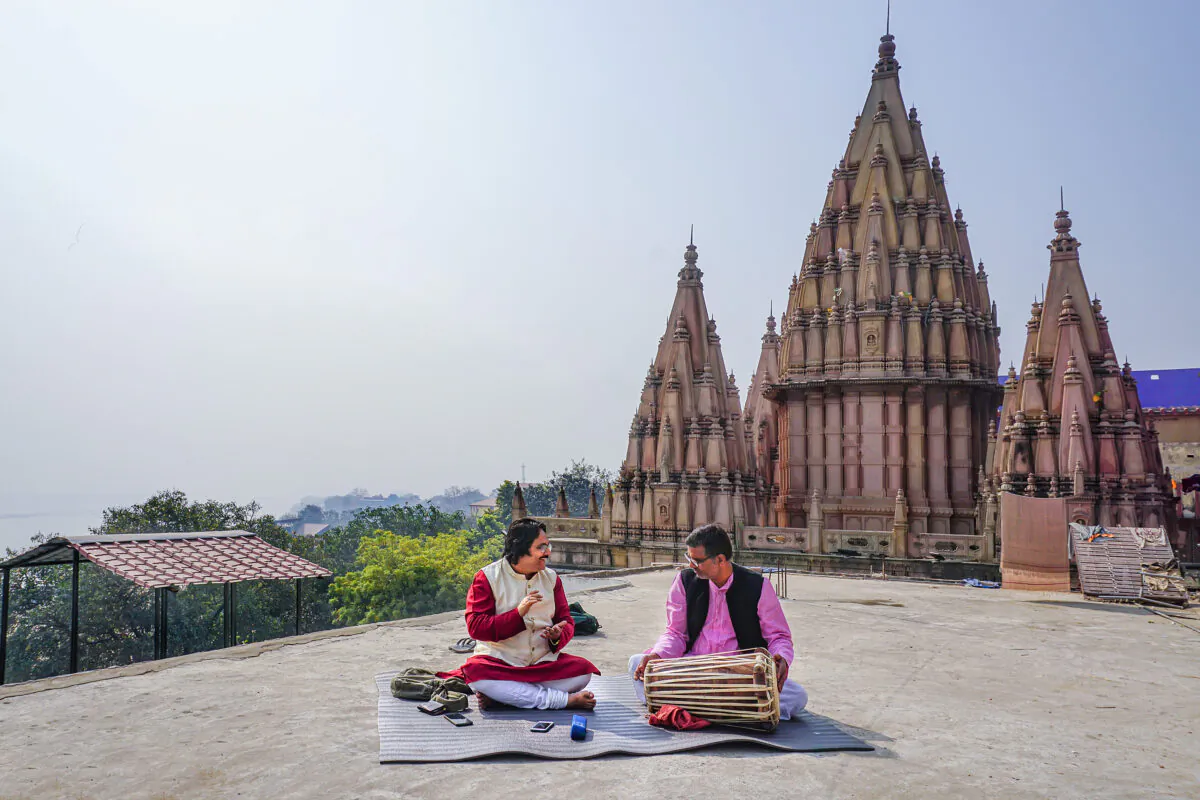 Classical musicians, Supriyo Maitro (L) and Ravishankar Shukla (R) practice the Dhrupad style of Indian music at the Assi Ghat in the ancient city of Kashi on Feb. 19, 2021. (Venus Upadhayaya/Epoch Times)