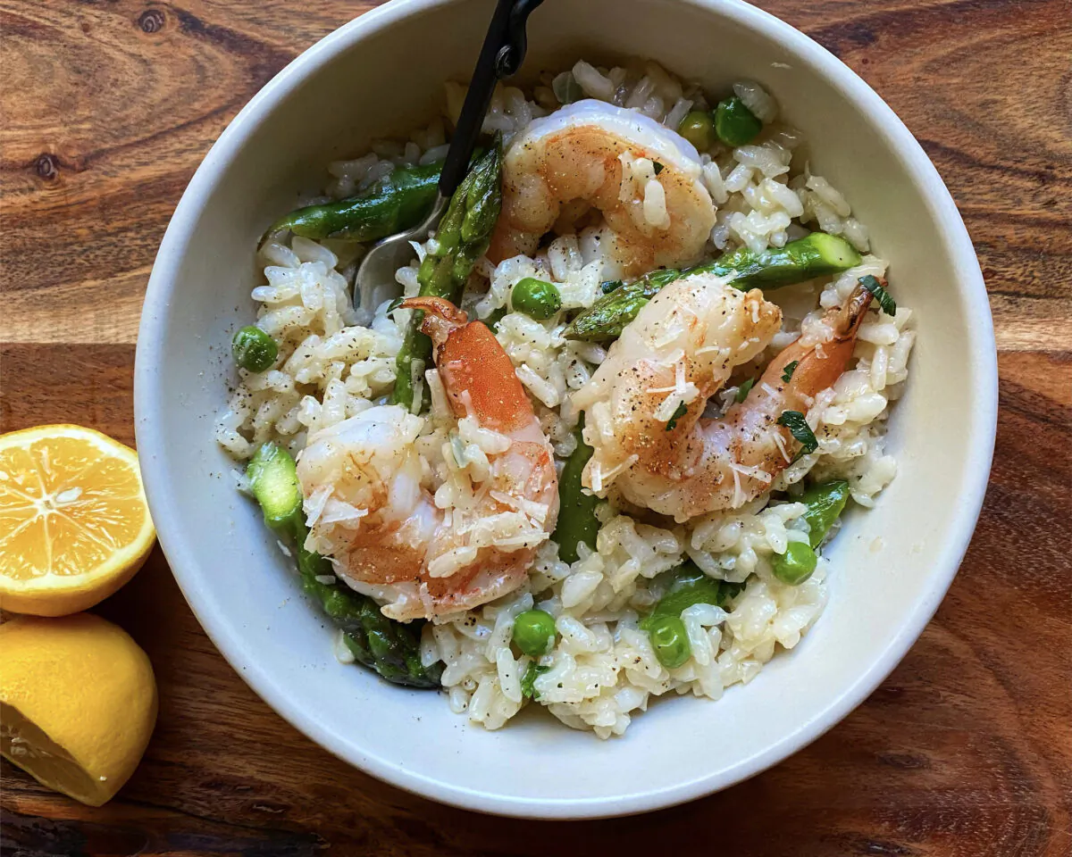 This risotto takes inspiration from pasta primavera, with fresh asparagus and peas studding the rice, along with sweet briny shrimp and juicy Meyer lemon. (Lynda Balslev for Tastefood)