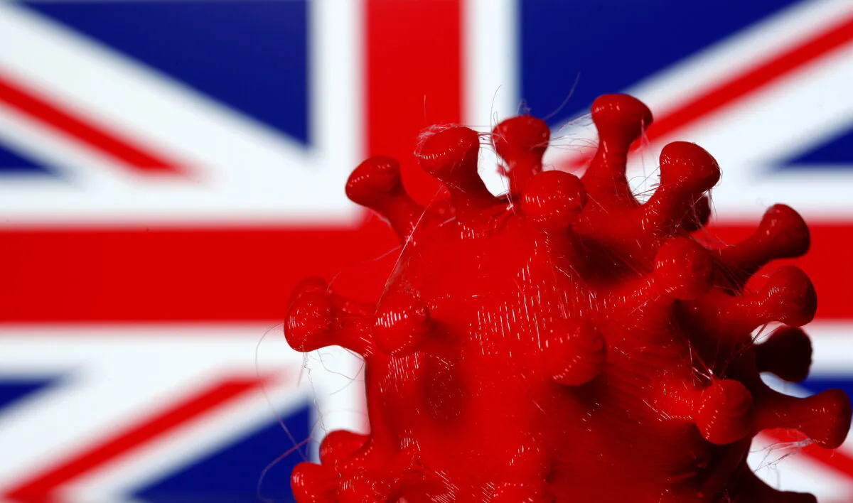 A 3D-printed CCP virus model is seen in front of a British flag on display in this illustration taken March 25, 2020. (Dado Ruvic/Illustration/Reuters)