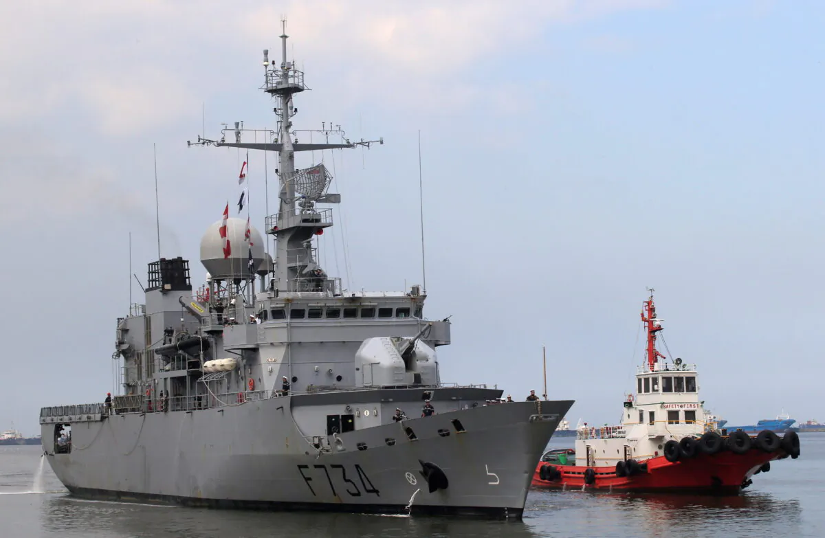 A tugboat escorts French Navy ship Vendemiaire (F734), a Floreal-classlight surveillance frigate of the French Marine Nationale, upon its arrival for a five-day goodwill visit at a port in Metro Manila, Philippines, on March 12, 2018. (Romeo Ranoco/Reuters)