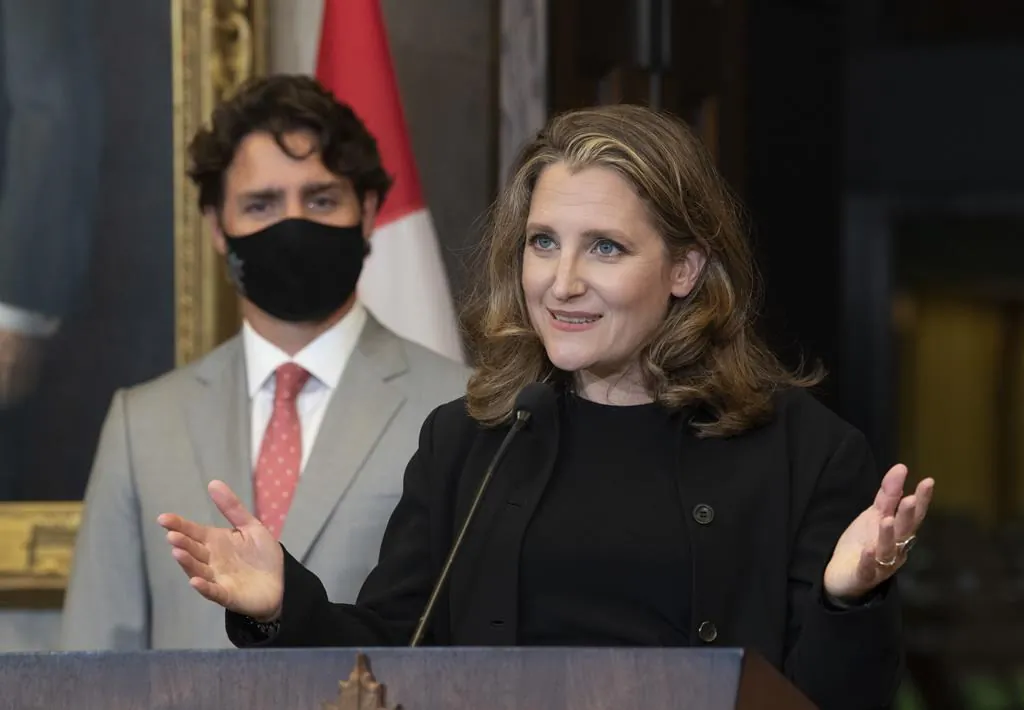 Prime Minister Justin Trudeau looks on as Deputy Prime Minister and Finance Minister Chrystia Freeland responds to a question during a news conference on Parliament Hill in Ottawa on Aug. 18, 2020. (THE CANADIAN PRESS/Adrian Wyld)