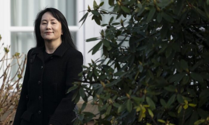 Chief Financial Officer of Huawei, Meng Wanzhou, leaves her home in Vancouver on March 25, 2021, to go to the B.C. Supreme Court. (Jonathan Hayward/The Canadian Press)